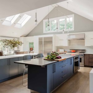 After: Kitchen toward Dining Room-Walls were removed, ceilings were raised, windows were replaced and expanded, and skylights were added