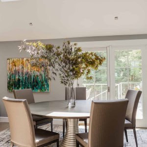 After: Dining Room-The roof slope in the dining area was changed to create a cathedral ceiling,