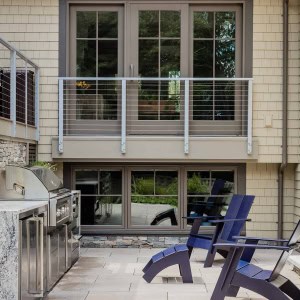 After: Outdoor Kitchen closeup-an original grilling area was replaced with a stainless built in outdoor kitchen encased in masonry, with a stone counter
