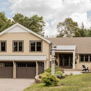 After: While the home’s footprint remained the same, the entire exterior and interior living spaces were transformed through a remodel. On the exterior this included siding, windows, roofing, front entry, back deck, outdoor kitchen area, and all hardscape.