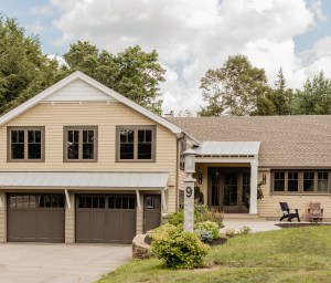 After: While the home’s footprint remained the same, the entire exterior and interior living spaces were transformed through a remodel. On the exterior this included siding, windows, roofing, front entry, back deck, outdoor kitchen area, and all hardscape.