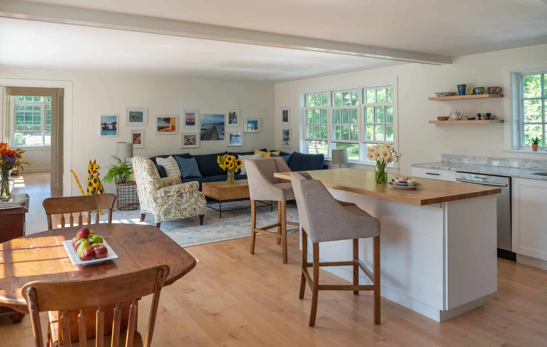 A light-filled combined kitchen, breakfast, and living area is the main space of the new in-law apartment; the bedroom and bathroom are spaces just beyond.