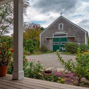 The view from the new porch is of a barn on the property named “Berry Patch Farm” because it had operated as a pick-your-own blueberry farm for many years.