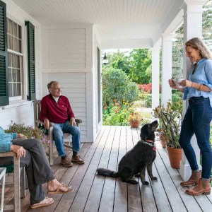 The family often gathers on the porch, which connects the old and new spaces.