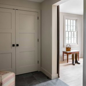 New mudroom is located behind the reclamined sliding doors.