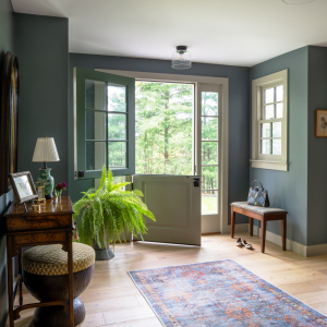 : The bumped-out entry interior is now elegant and spacious. A Dutch door allows light and air to flow into the house, while a side window offers additional light. Flooring throughout first floor is wide plank, character grade Oak, whose knotting adds character. The modern finish adds a contemporary touch to a traditional look.