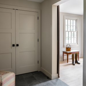 New mudroom is located behind the reclamined sliding doors.