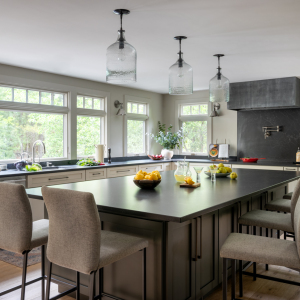 The kitchen’s footprint was expanded with a 4-foot bump-out off the back of the house. Natural light and views to the backyard were improved with awning windows, topped with transoms, to let in additional light. 