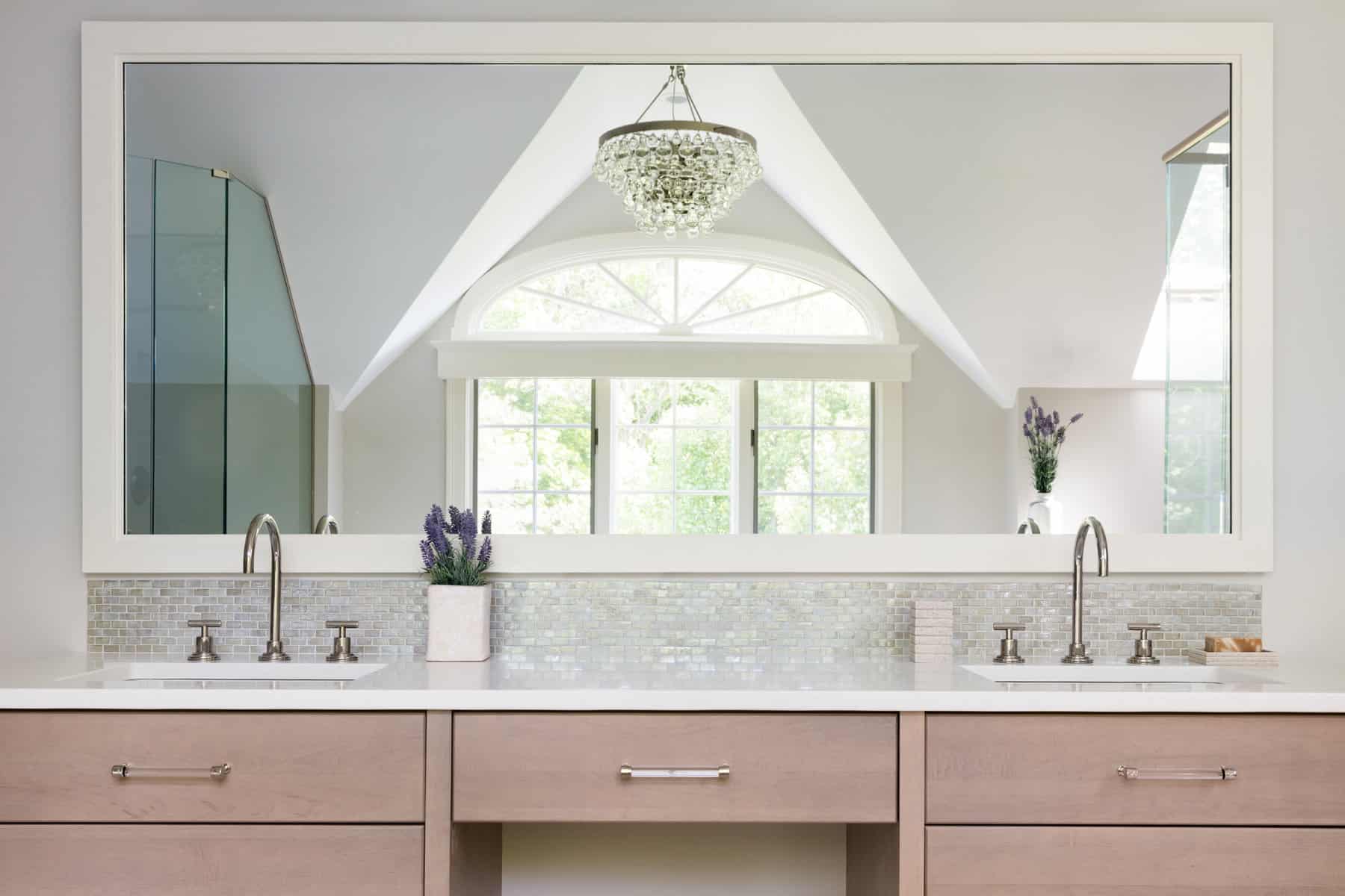 RELAXING RETREAT MASTER BATH--The large double vanity features Lacava undermount sinks, with a center makeup counter.
