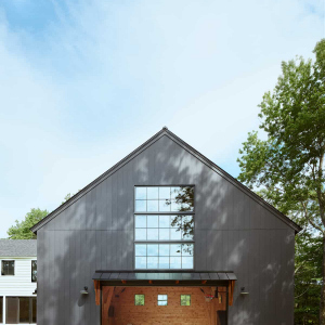 The barn is attached to the basement level home exercise room,