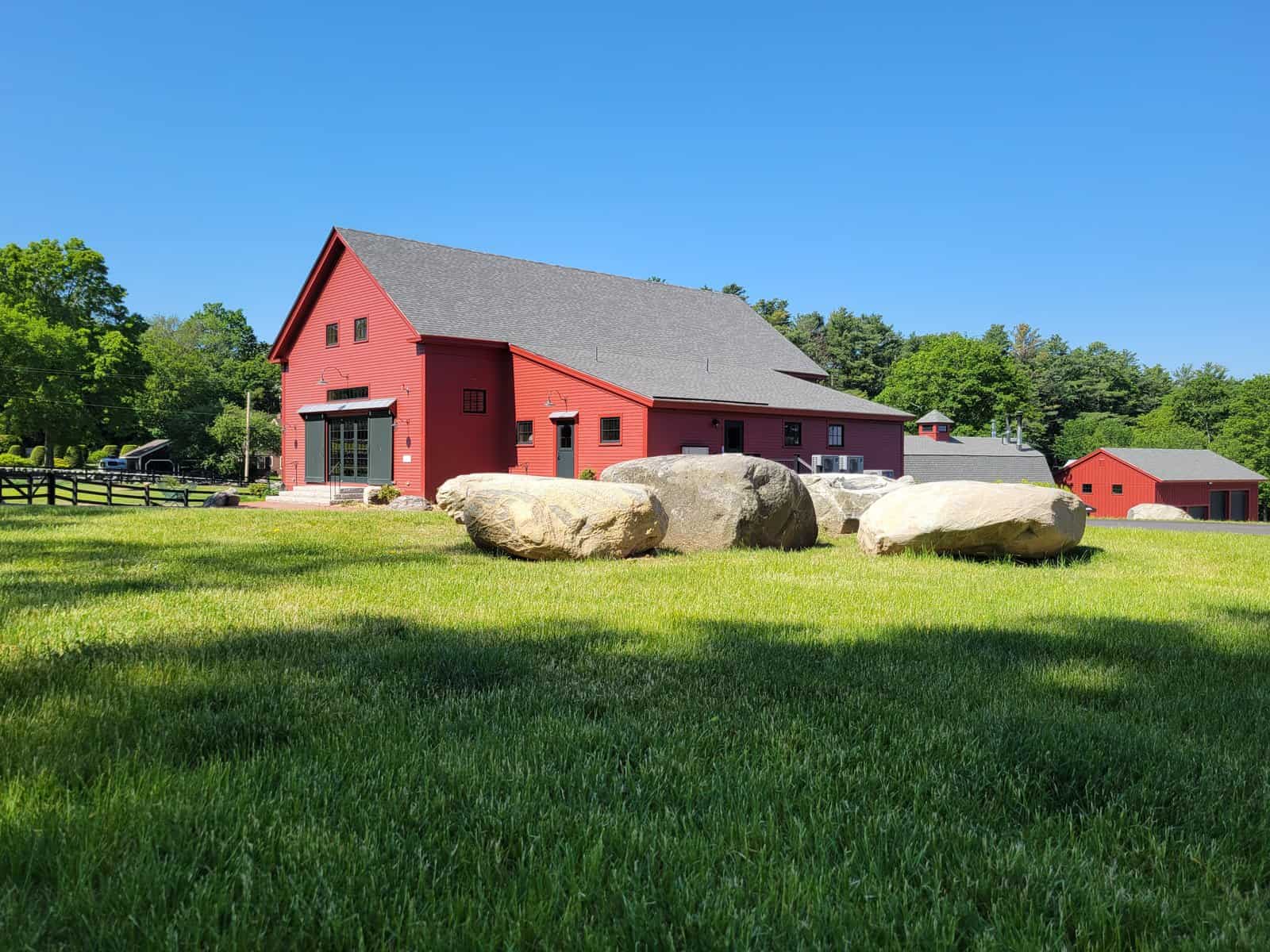The project entailed: 1) partially restoring and renovating two barns that originated in 1793 and 1806;  2) converting an old bull barn into a maple sugaring barn; 3) constructing a new barn to house machinery; and 4) offsetting electricity with a field of solar panels, making the property net-zero.