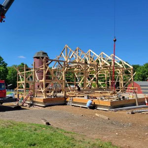 Portions of the structure had disintegrated, but after a timber specialist determined the date of the barn's frame, the decision was made to dismantle it, salvage the timbers, and replace rotting pieces. The robust salvaged frame was then reassembled along with two additional new sections. (photo by Benjamin Nutter Architects)