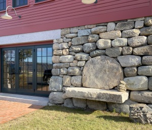 1793-Barn-Exterior Rear features a built in stone bench with stones sourced from property. Stonework by Eric Peterson Landscaping.