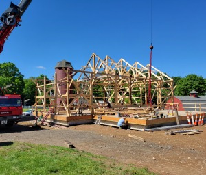 Portions of the structure had disintegrated, but after a timber specialist determined the date of the barn's frame, the decision was made to dismantle it, salvage the timbers, and replace rotting pieces. The robust salvaged frame was then reassembled along with two additional new sections. (photo by Benjamin Nutter Architects)