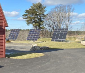 A solar array next to the sugaring barn contributes to making the property net-zero -- it produces more energy than it uses.