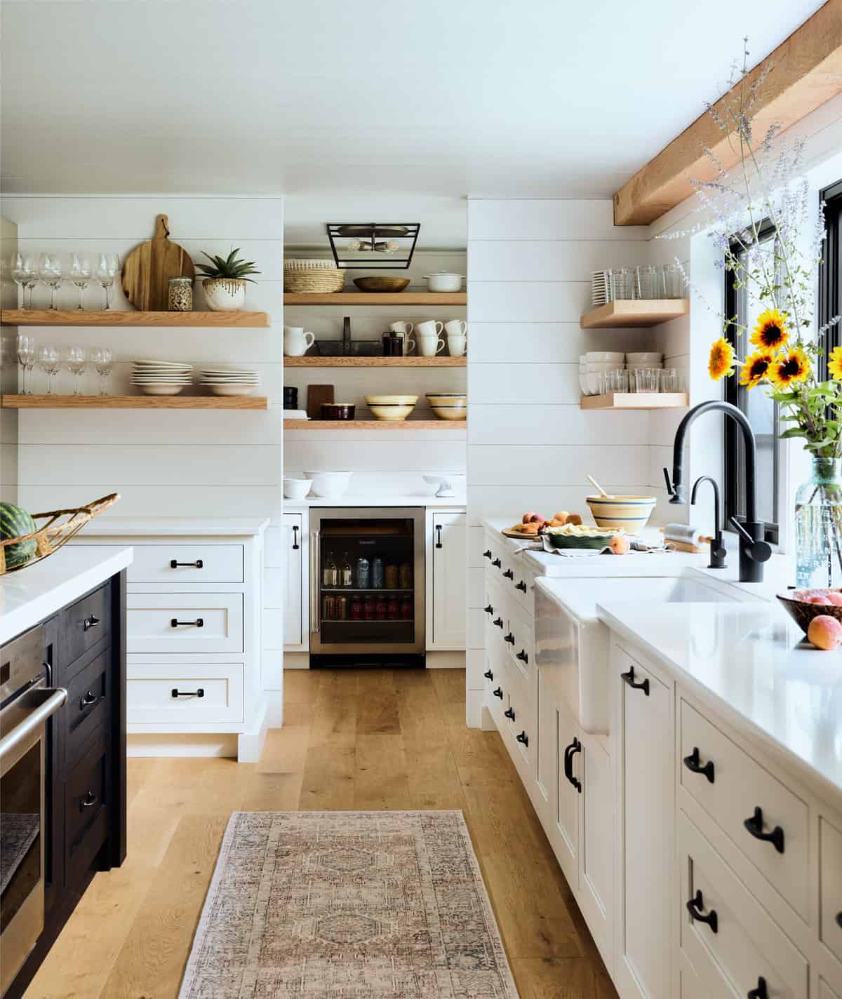 This kitchen was renovated as part of a whole house transformation.  A new walk-in pantry is tucked away where the original center chimney was removed.