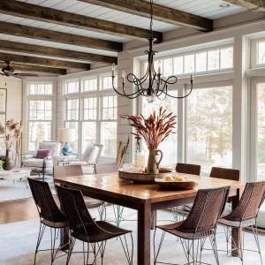AFTER Breakfast Area- A wall was removed to connect breakfast to sunroom, two sets of French glass sliding doors now lead to pool. New space features floor to ceiling shiplap paneling and rustic wood beams.