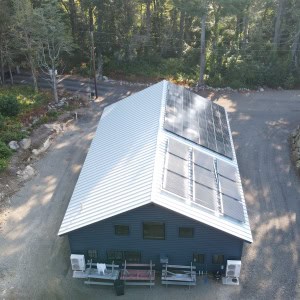 The barn’s conventional photovoltaic paneled roof converts sunlight into electricity, while hydronic panels heat water.  The panels generate more energy than the building uses, making it "net-zero". 