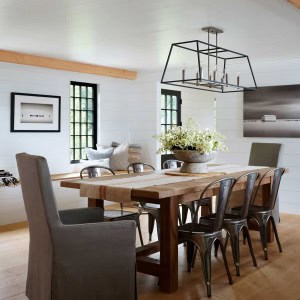 18-Dining-Room-AFTER. An inviting bench under the windows fills previously unused space, while creating storage and a seat with great views . Shiplap walls throughout the house contribute to the modern rustic feeling. Floors are engineered wide plank French Oak.