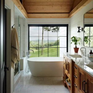 22-Master-Bath-AFTER. All fixtures, except the vanity, were rearranged. A separate water closet was created. A new vaulted, wood paneled ceiling lightens, yet warms, the space.  A floor to ceiling feature window frames the view.