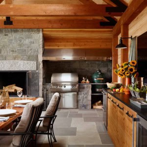 25-New-Addition-Outdoor-Room-Kitchen-area. Custom made cabinets match the wall paneling.