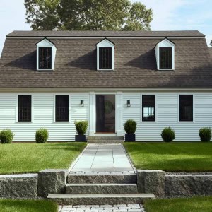 4-Front-Exterior-Closeup-AFTER - The front was improved with a new dormer, providing balance and symmetry, and new landscaping.
