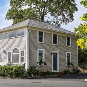 Front Exterior-This 1890’s Newburyport Fisherman’s cottage overlooks the Merrimack River and is within walking distance of downtown. When the homeowners found the cottage, they knew it had great bones and loved the incredible water views. Without adding to the square footage, the fisherman’s cottage was transformed to a light-filled, modern home that is highly efficient and functional.