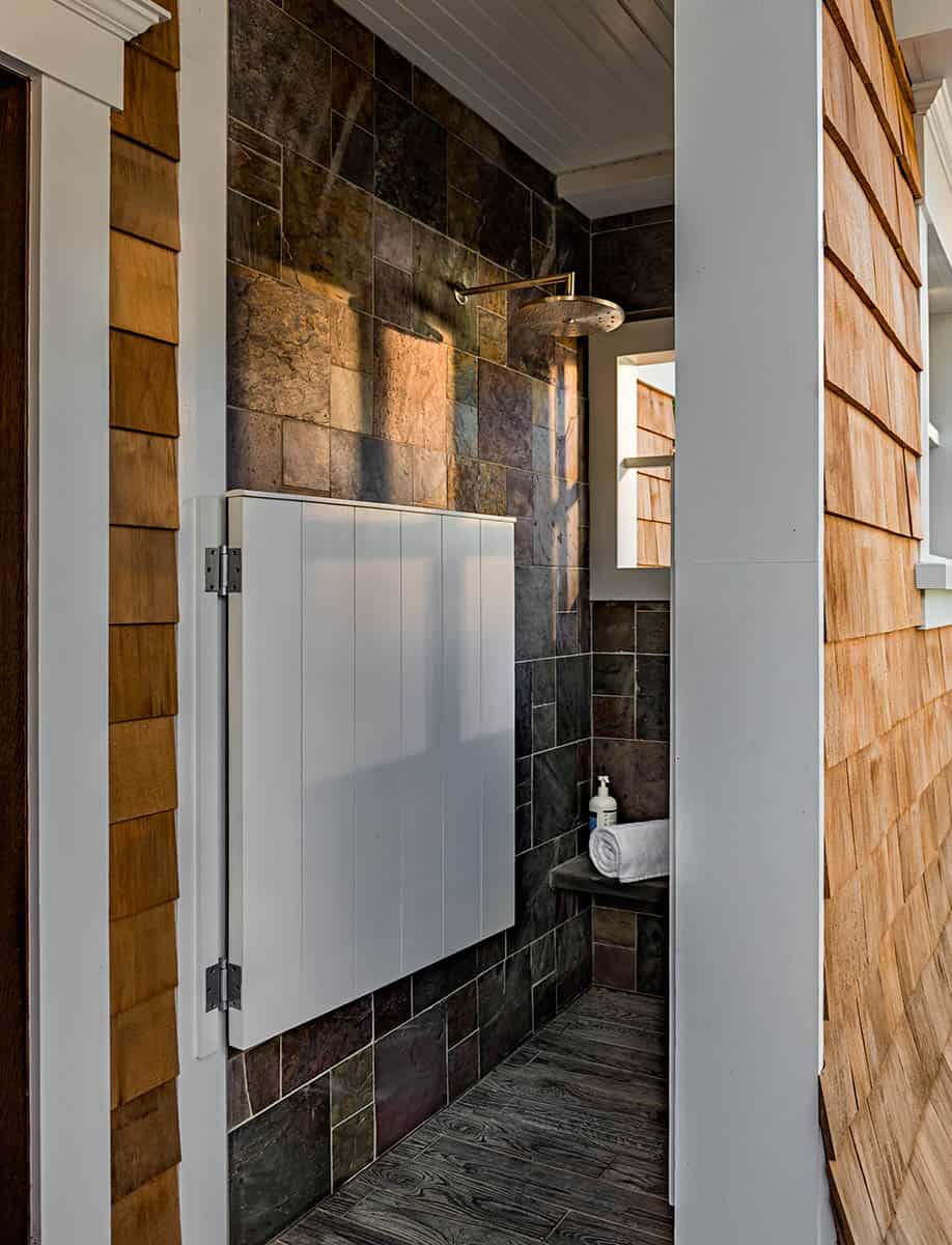 Outdoor shower, located just outside the pool house, tucked under pergola.