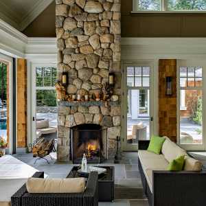 Three season room with two sided fireplace. Phantom walls provide flexibilty so the room can become an outdoor space or have screens or glass