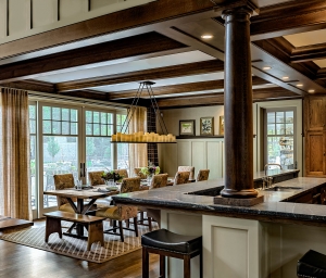 View toward dining with large picture window overlooking yard. A door to the three-season room offers easy access to an outdoor kitchen and living area.