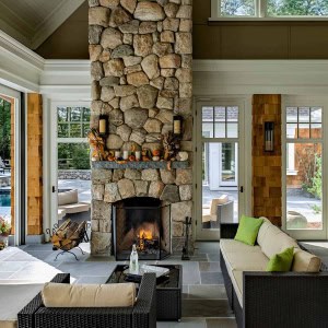 Three season room with two sided fireplace and phantom screens (choice of no walls, screens, or glass).