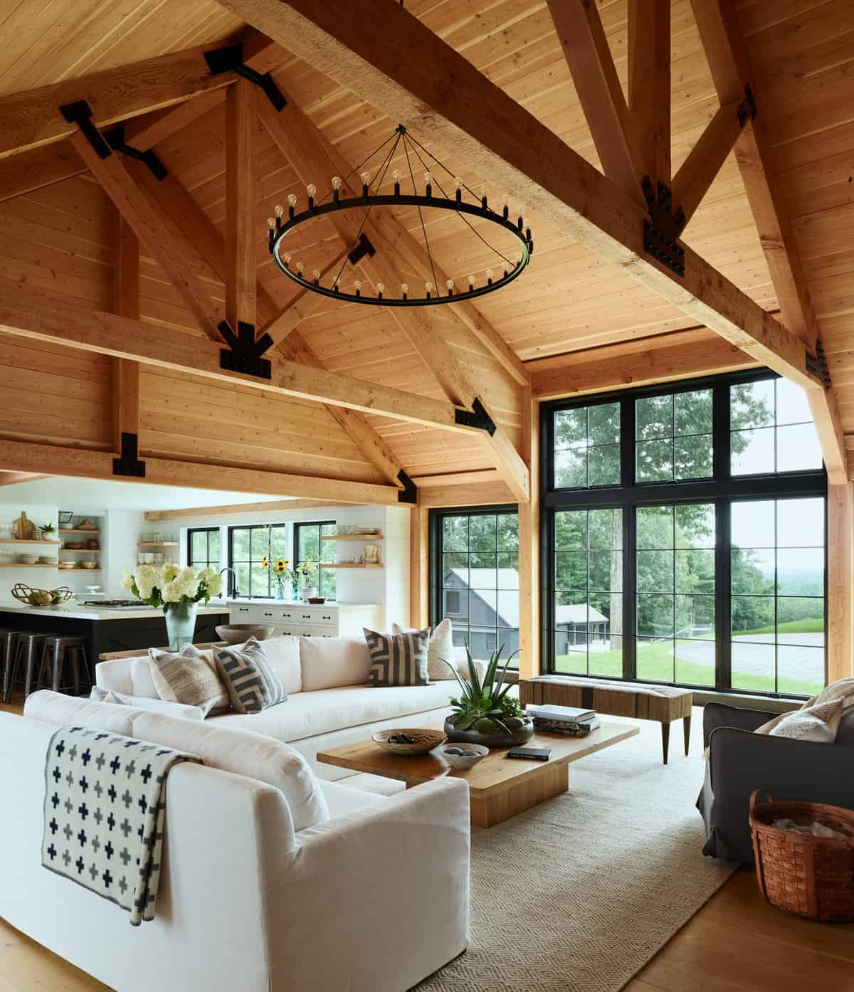 The transitional Douglas Fir exposed timber frame, with it’s rough-sawn face, is both structural and decorative. It combines traditional mortise & tenon joinery with more current black iron connecting plates. The result is rustic, yet sophisticated, adding warmth and stunning architectural detail to the home. All ceiling paneling is also rough sawn Douglas Fir to match the timbers.