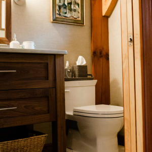 12) AFTER.The renovated powder room features a custom-made walnut vanity with quartzite counter to match the kitchen.