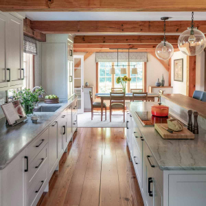 AFTER view to dining area. Custom sideboard cabinets with walnut tops match the island and give dining area a more refined feel