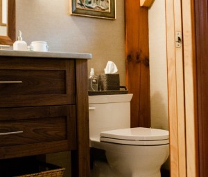 12) AFTER.The renovated powder room features a custom-made walnut vanity with quartzite counter to match the kitchen.