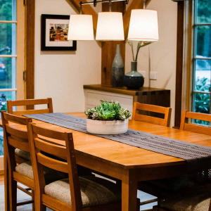 Dining area closeup. Custom sideboard built-in cabinets with walnut tops match the island.