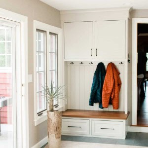 Breezeway mudroom built-in with walnut bench to coordinate with kitchen island