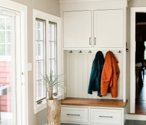Breezeway mudroom built-in with walnut bench to coordinate with kitchen island