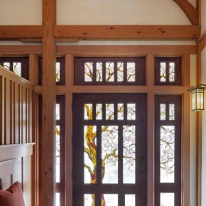 custom stained glass entry contains 14,000 pieces of glass to depict a blooming magnolia tree