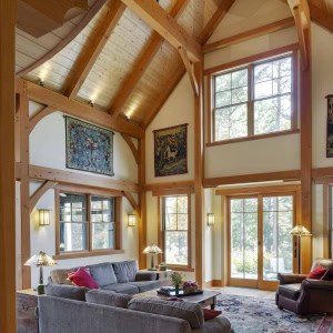 The soaring living room looks towards the garden